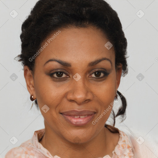 Joyful black adult female with short  brown hair and brown eyes