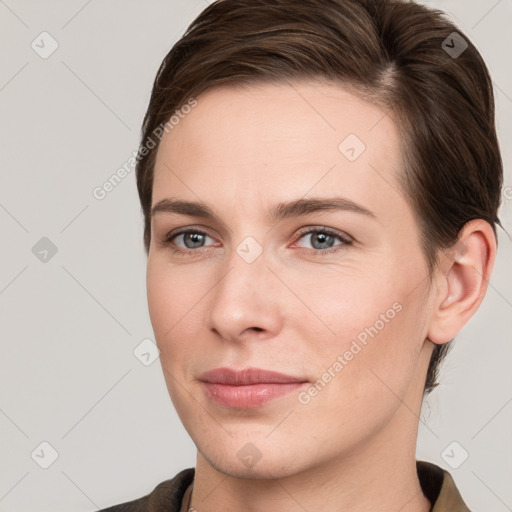 Joyful white young-adult female with short  brown hair and brown eyes