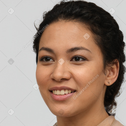 Joyful latino young-adult female with medium  brown hair and brown eyes