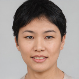 Joyful asian young-adult female with short  black hair and brown eyes