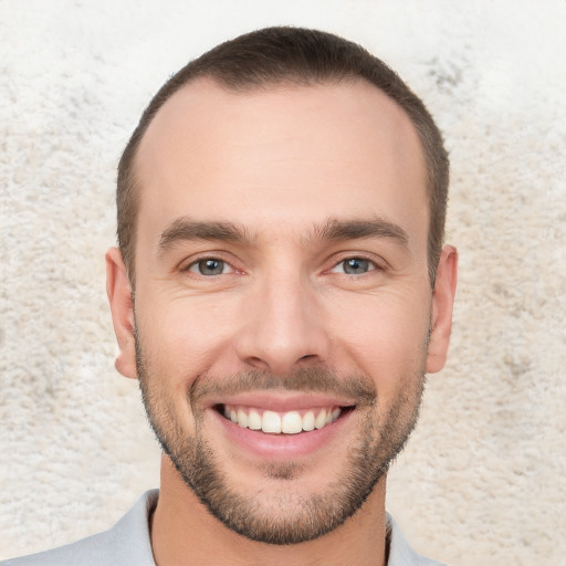 Joyful white young-adult male with short  brown hair and brown eyes