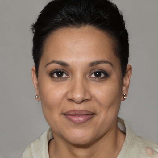 Joyful white adult female with short  brown hair and brown eyes