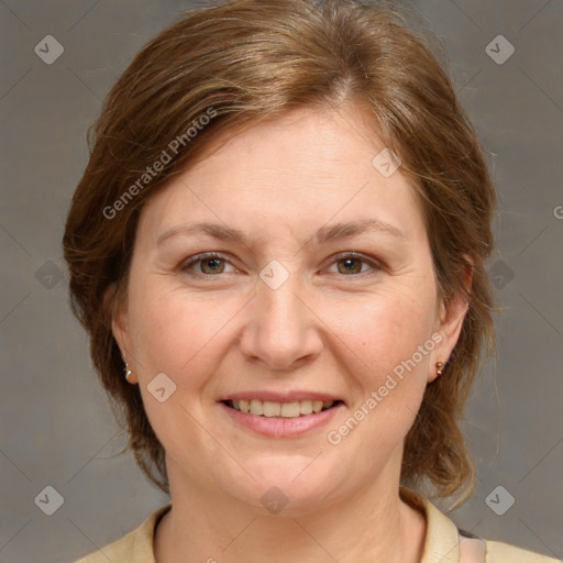 Joyful white adult female with medium  brown hair and grey eyes