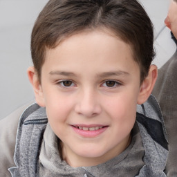 Joyful white child female with short  brown hair and brown eyes