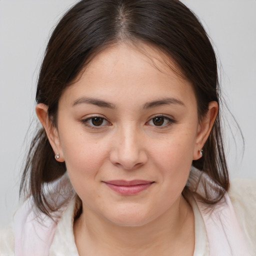 Joyful white young-adult female with medium  brown hair and brown eyes