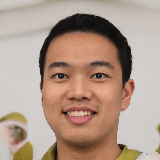 Joyful asian young-adult male with short  black hair and brown eyes