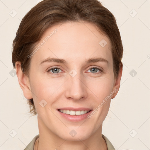 Joyful white young-adult female with short  brown hair and grey eyes