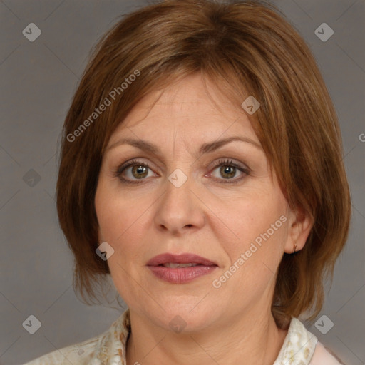 Joyful white adult female with medium  brown hair and grey eyes