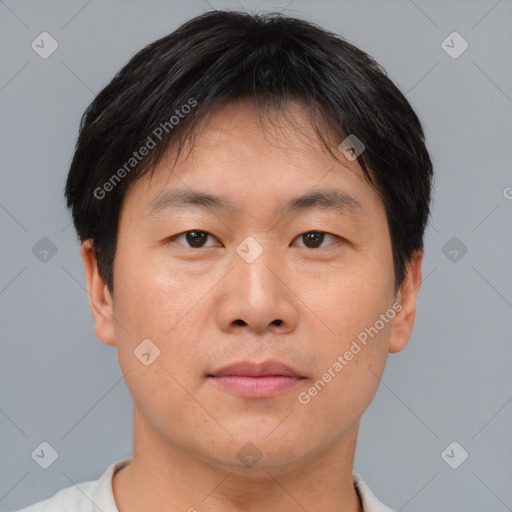 Neutral asian young-adult male with short  brown hair and brown eyes