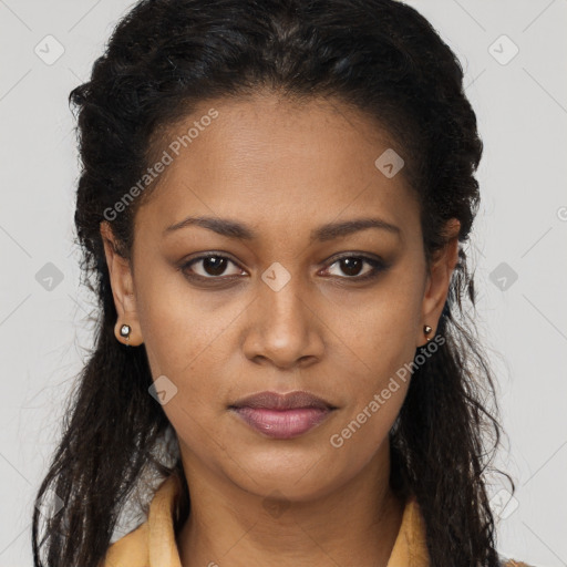 Joyful black young-adult female with long  brown hair and brown eyes