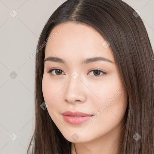 Neutral white young-adult female with long  brown hair and brown eyes