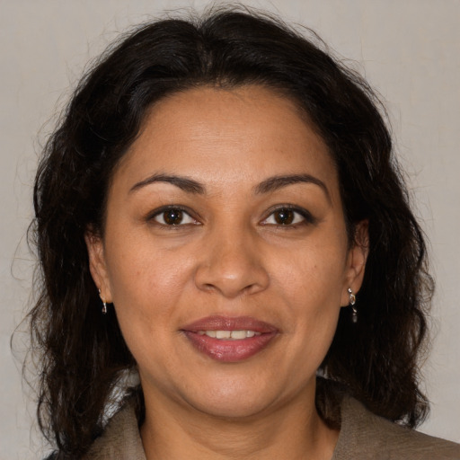 Joyful white adult female with medium  brown hair and brown eyes