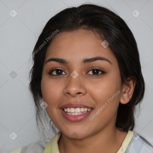 Joyful latino young-adult female with medium  brown hair and brown eyes