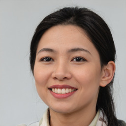 Joyful asian young-adult female with medium  brown hair and brown eyes