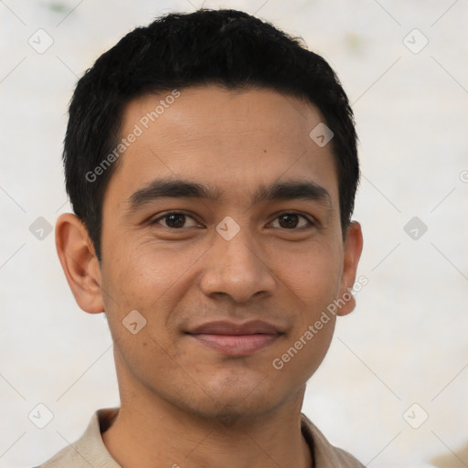 Joyful latino young-adult male with short  black hair and brown eyes