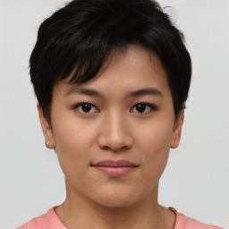 Joyful asian young-adult female with short  brown hair and brown eyes