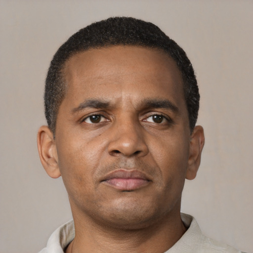 Neutral black adult male with short  brown hair and brown eyes