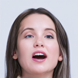 Joyful white young-adult female with long  brown hair and blue eyes