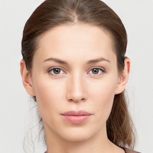 Neutral white young-adult female with medium  brown hair and brown eyes