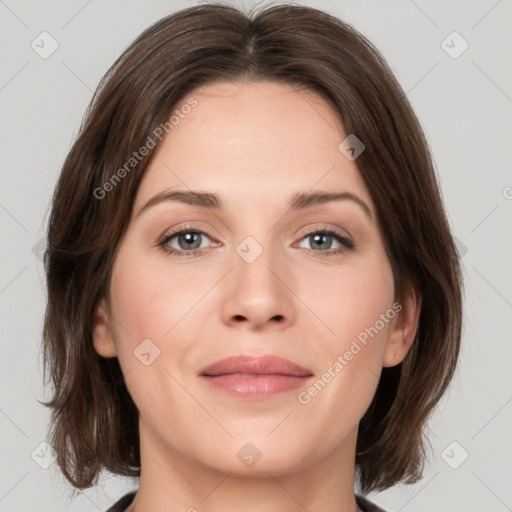 Joyful white young-adult female with medium  brown hair and green eyes