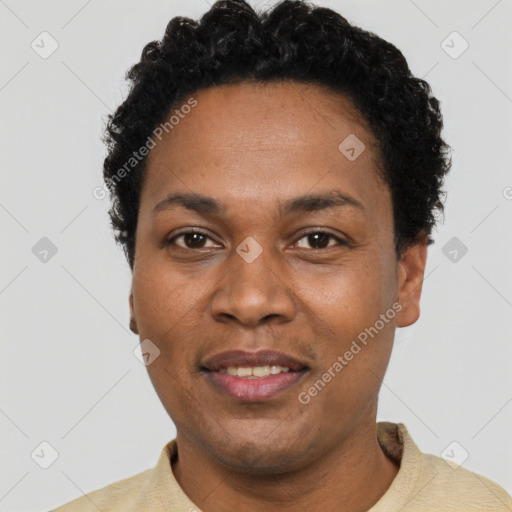 Joyful black young-adult female with short  black hair and brown eyes