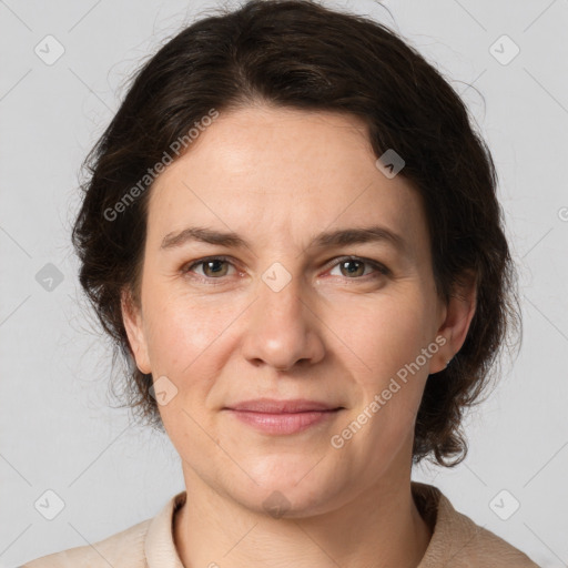 Joyful white adult female with medium  brown hair and grey eyes