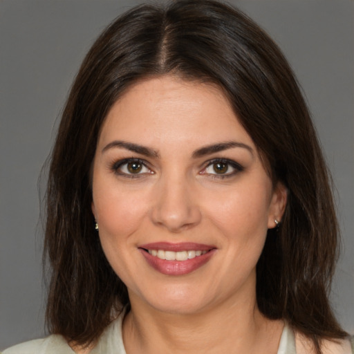 Joyful white young-adult female with medium  brown hair and brown eyes