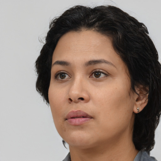 Neutral latino young-adult female with medium  black hair and brown eyes