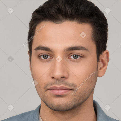 Neutral white young-adult male with short  brown hair and brown eyes