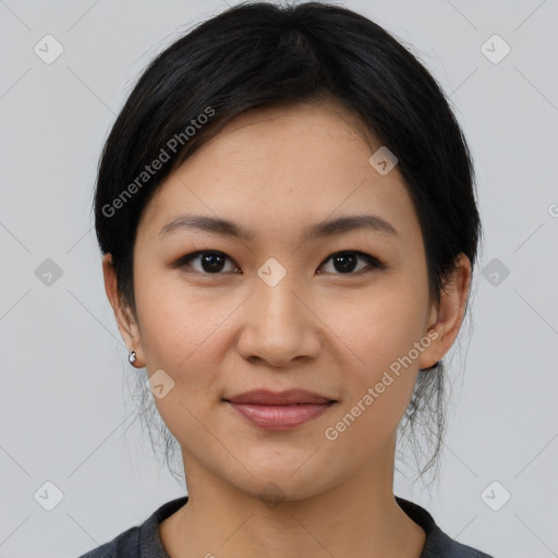 Joyful latino young-adult female with medium  black hair and brown eyes