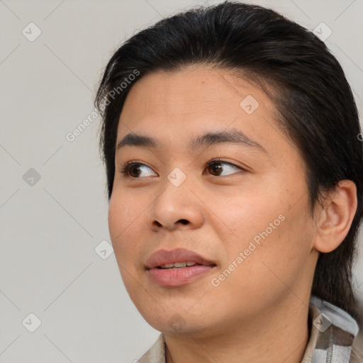 Joyful asian young-adult female with medium  brown hair and brown eyes