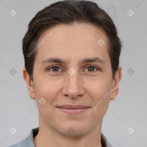 Joyful white adult male with short  brown hair and brown eyes