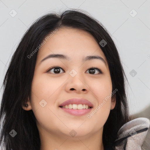 Joyful asian young-adult female with long  brown hair and brown eyes