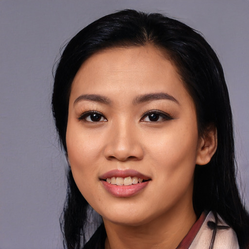 Joyful asian young-adult female with long  black hair and brown eyes