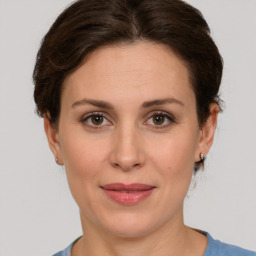 Joyful white adult female with short  brown hair and brown eyes