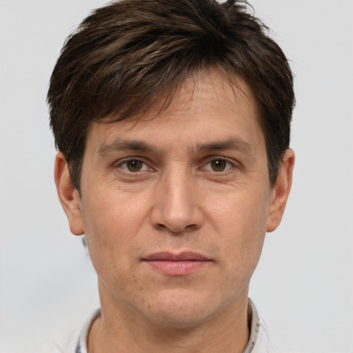 Joyful white adult male with short  brown hair and brown eyes