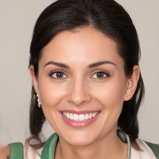 Joyful white young-adult female with medium  brown hair and brown eyes