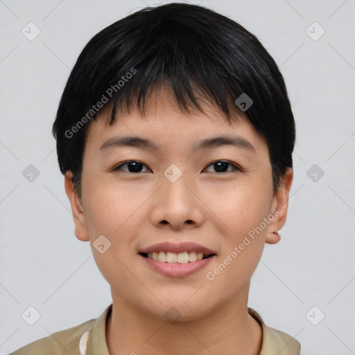 Joyful asian young-adult female with short  black hair and brown eyes