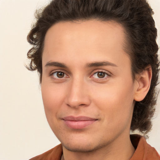 Joyful white young-adult male with medium  brown hair and brown eyes