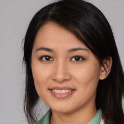 Joyful asian young-adult female with medium  brown hair and brown eyes