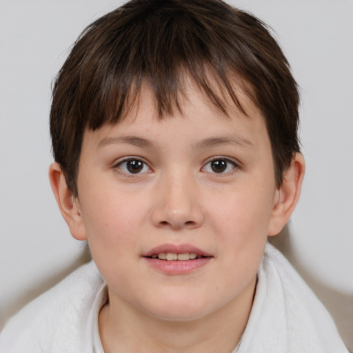 Joyful white child female with short  brown hair and brown eyes