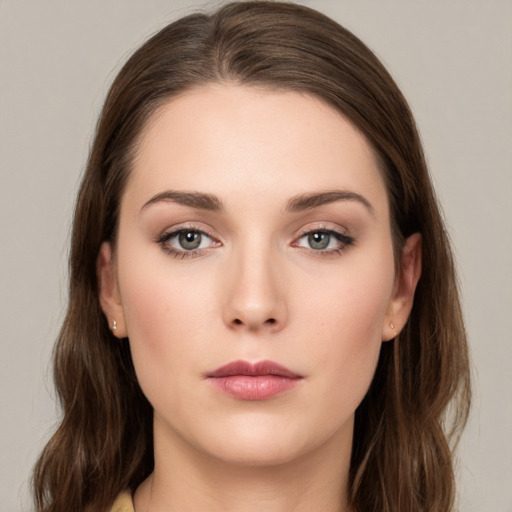 Neutral white young-adult female with medium  brown hair and green eyes