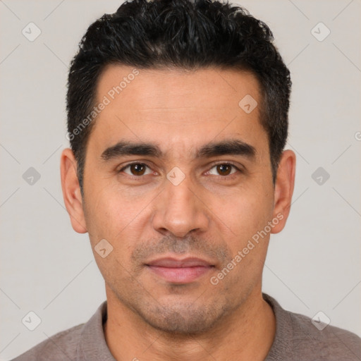 Joyful white young-adult male with short  black hair and brown eyes