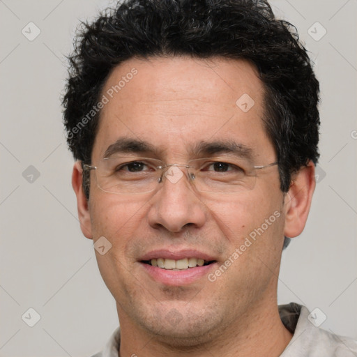 Joyful white adult male with short  black hair and brown eyes