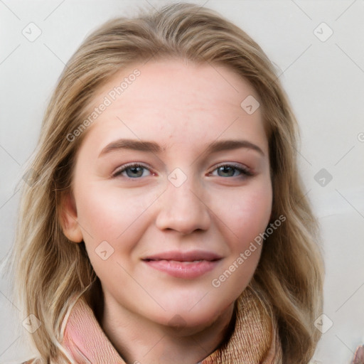 Joyful white young-adult female with long  brown hair and blue eyes