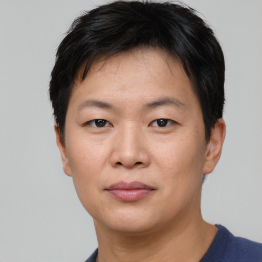 Neutral asian young-adult male with short  brown hair and brown eyes