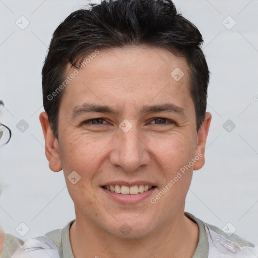 Joyful white adult male with short  brown hair and brown eyes