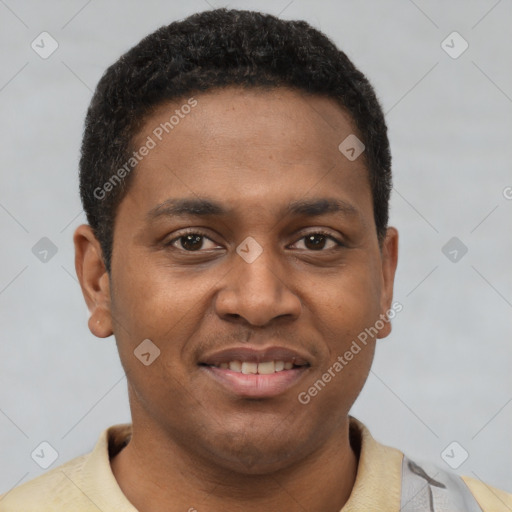 Joyful latino young-adult male with short  brown hair and brown eyes