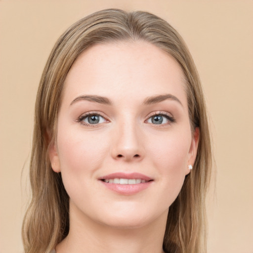 Joyful white young-adult female with long  brown hair and grey eyes