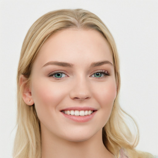 Joyful white young-adult female with long  brown hair and blue eyes